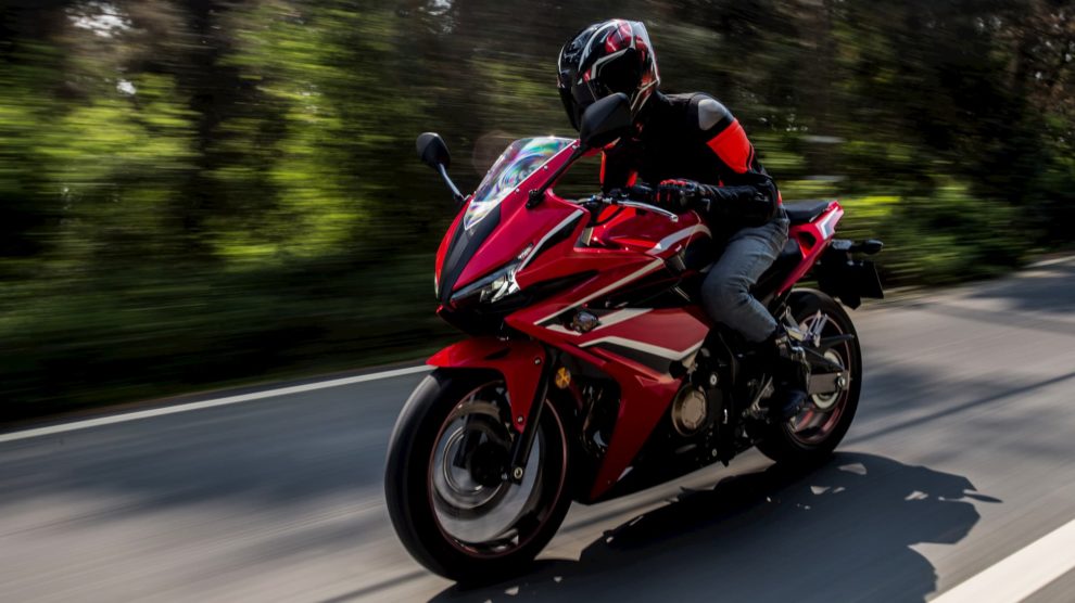 Rider on red Honda motorbike